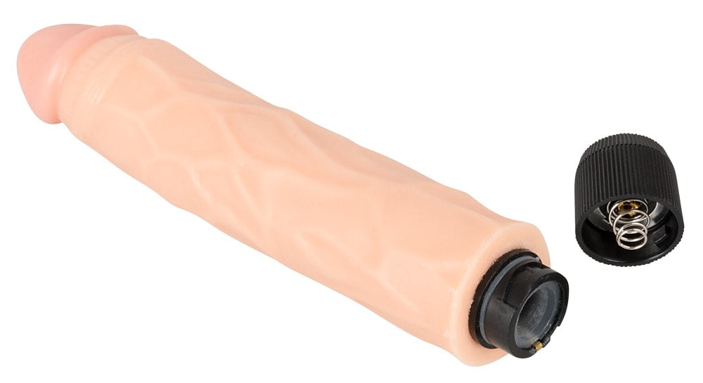 Detailed close-up of one of the included vibrator attachments with twist-off cap for battery access.