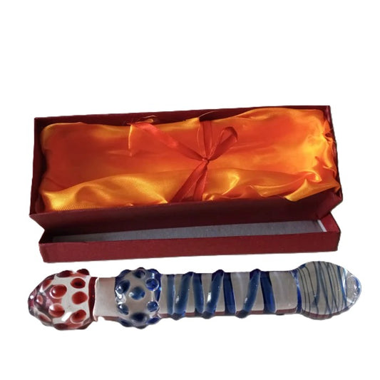 Dual-textured glass dildo with red dots and blue spiral grooves in silk-lined gift box