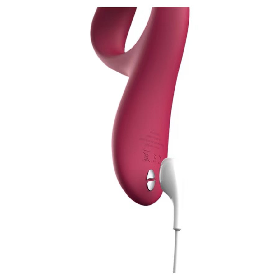 Close-up of Nova Rabbit Vibrator with magnetic charging cable connected to the base